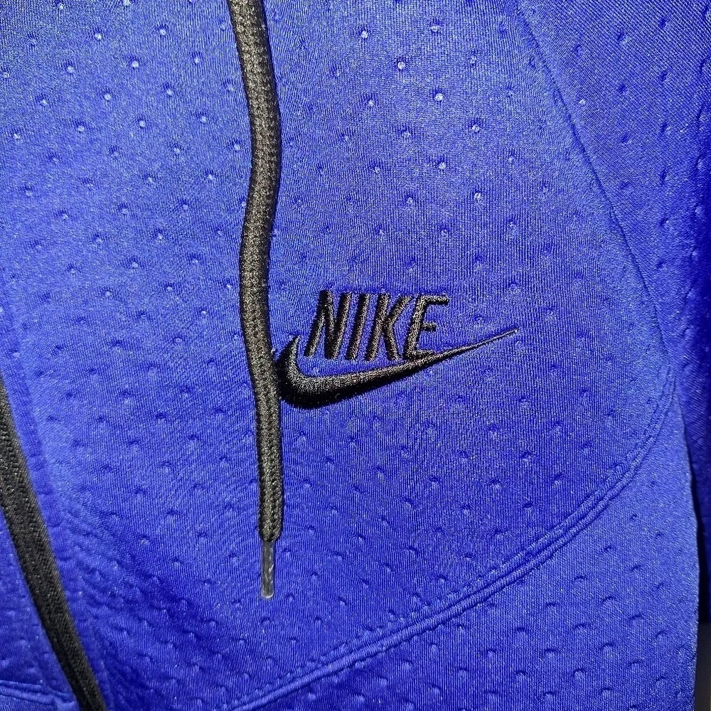 A Nike hooded full zip men's small jacket in blue. It's in excellent condition